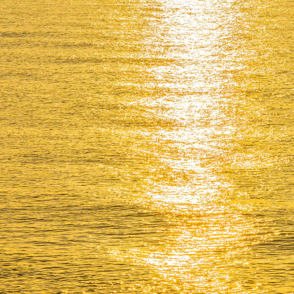 gold-sunlight-on-ocean-water Gold sunlight reflected on ocean water